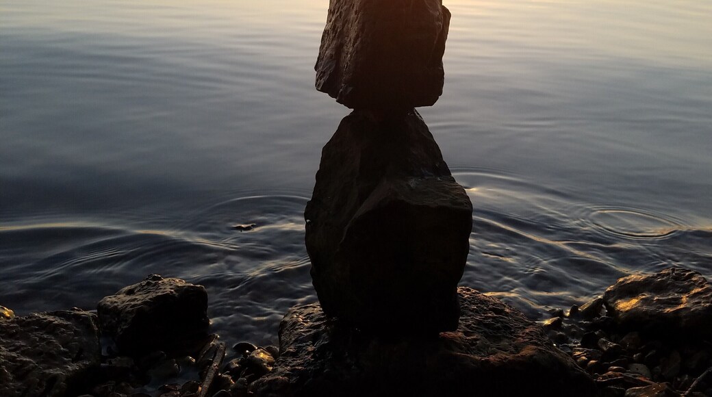 Stockton lake at sunset can be an amazing time. If you are able and have 4 wheel drive, you can find beaches like this one with no one else around.