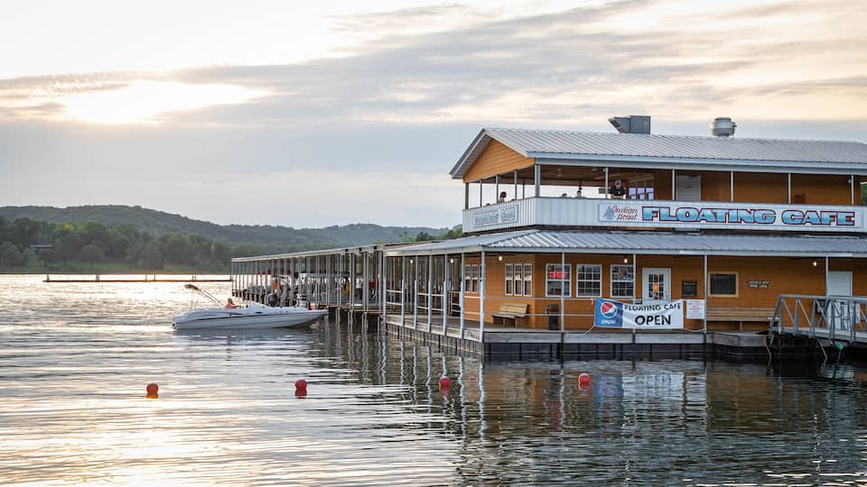 A floating cafe with a sign that reads "Floating Cafe" and "Open".