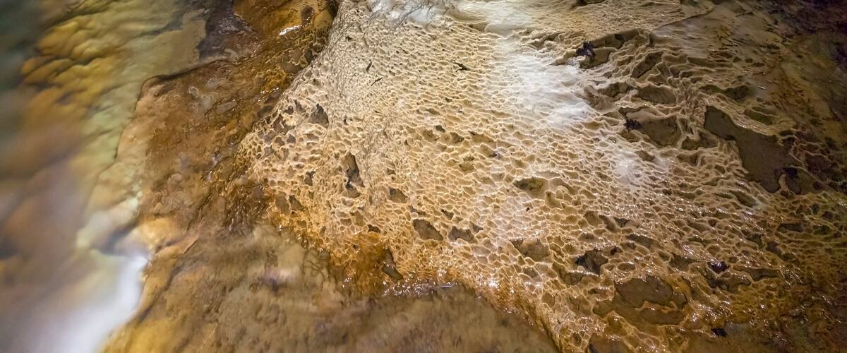 Intricate and colorful flow stone formations adorn Indian's Port Cave.
