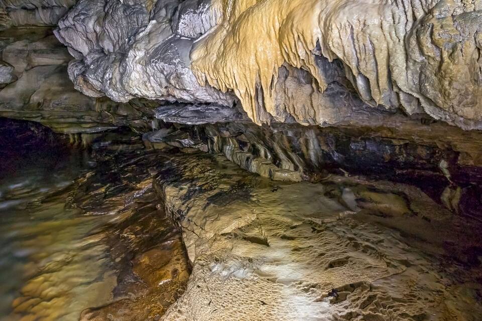 A cave with stalactites and stalagmites.