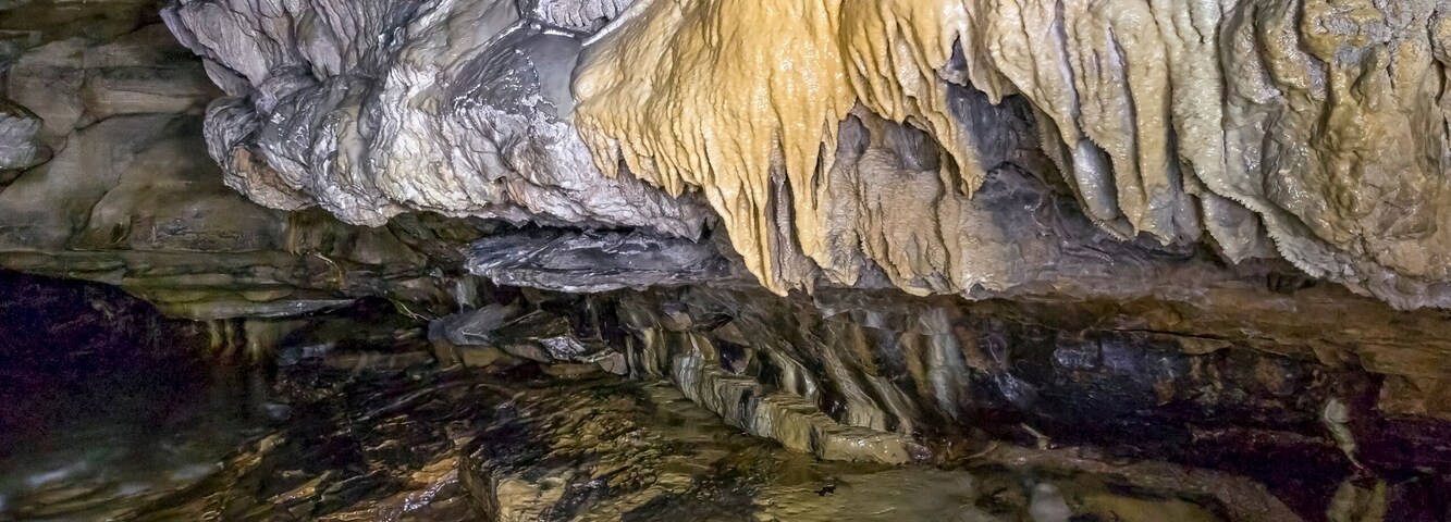 Intricate and colorful flow stone formations adorn Indian's Port Cave.