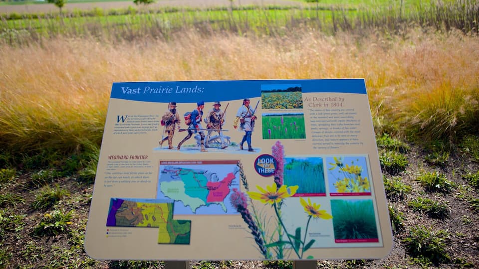 A historical marker detailing the Westward Frontier, featuring maps, illustrations, and descriptions of the vast prairie lands.