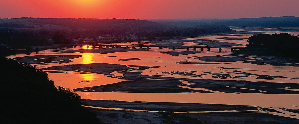 Lincoln which includes a sunset, landscape views and a river or creek