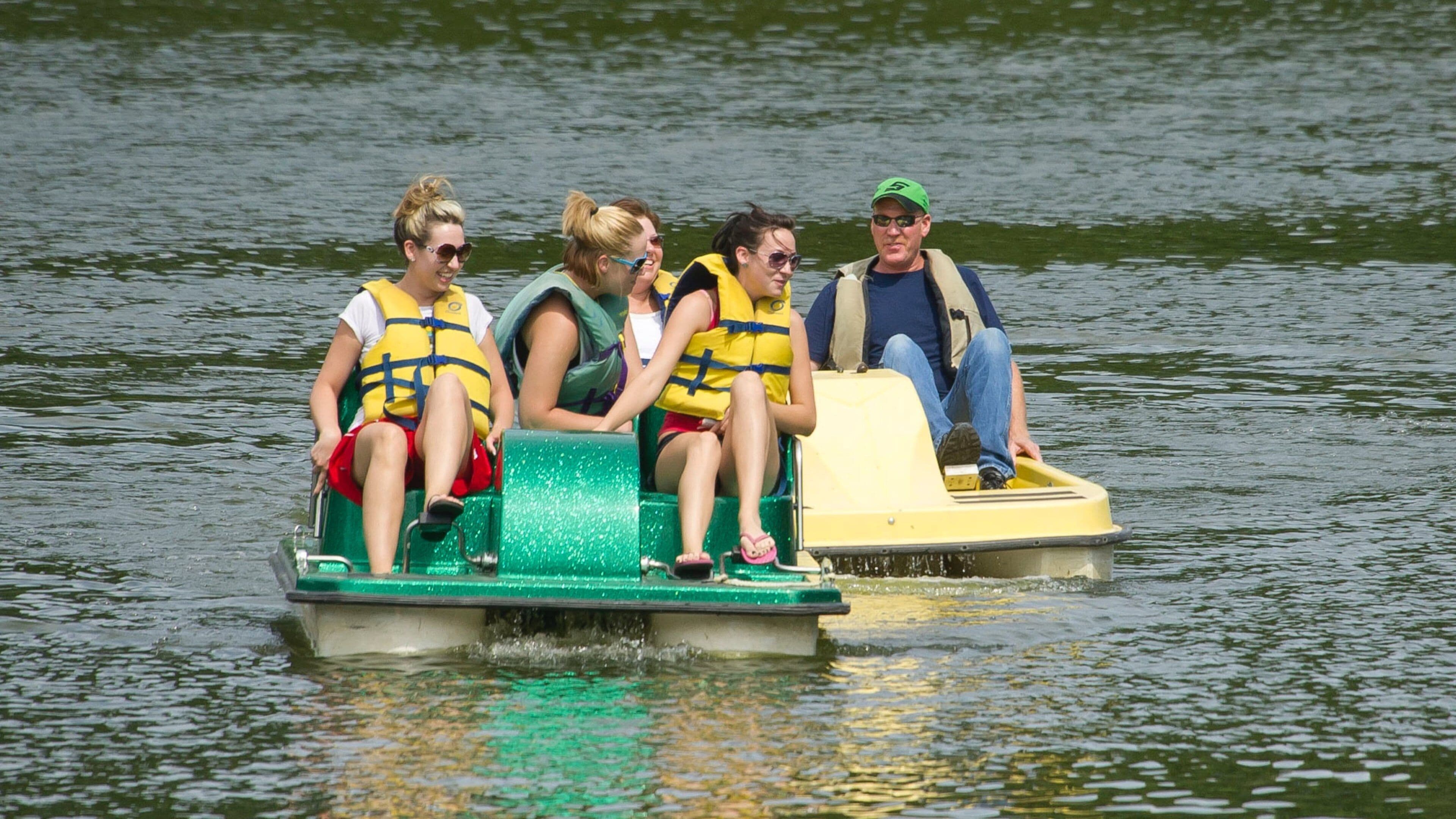 Lincoln showing watersports and a river or creek as well as a small group of people