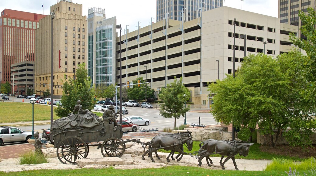 Pioneer Courage Park showing a city and a statue or sculpture