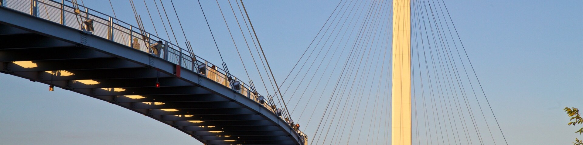 Bob Kerrey Pedestrian Bridge featuring a sunset and a bridge
