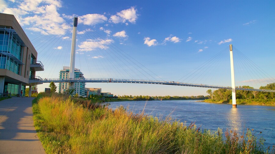 Bob Kerrey Pedestrian Bridge which includes a river or creek, a sunset and a bridge