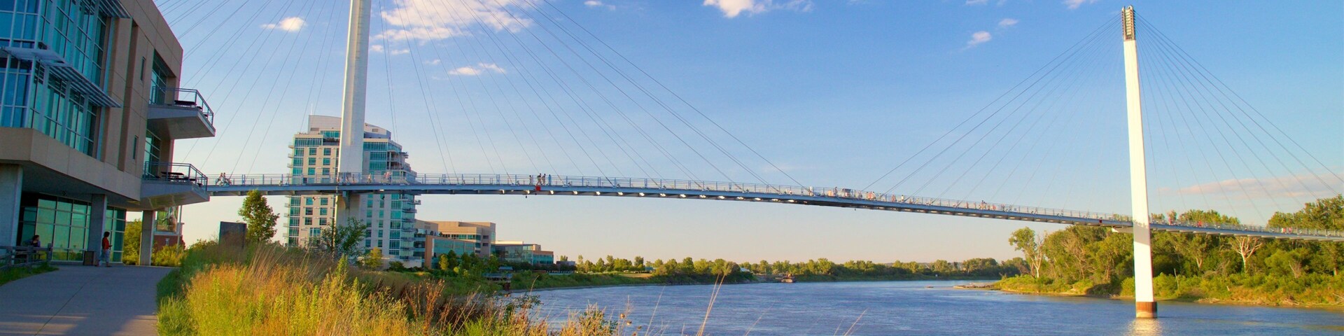 Bob Kerrey Pedestrian Bridge which includes a river or creek, a sunset and a bridge