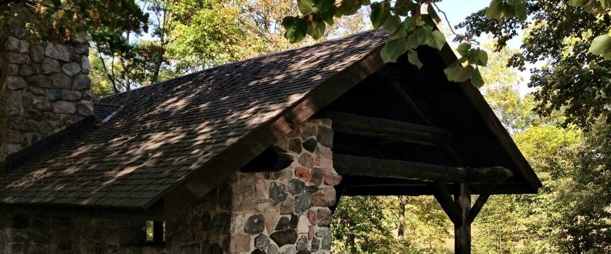 Rustic picnic shelter in September, many hiking trails are nearby and wind for miles in the woods.
