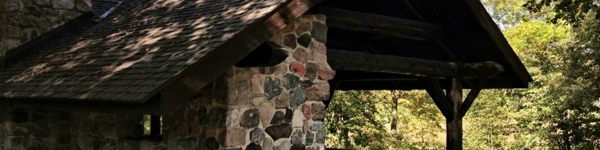Rustic picnic shelter in September, many hiking trails are nearby and wind for miles in the woods.
