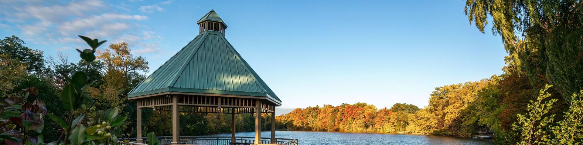 A gazebo park structure in autumn at Mill Pond in Centennial Park, Milton, Ontario, Canada