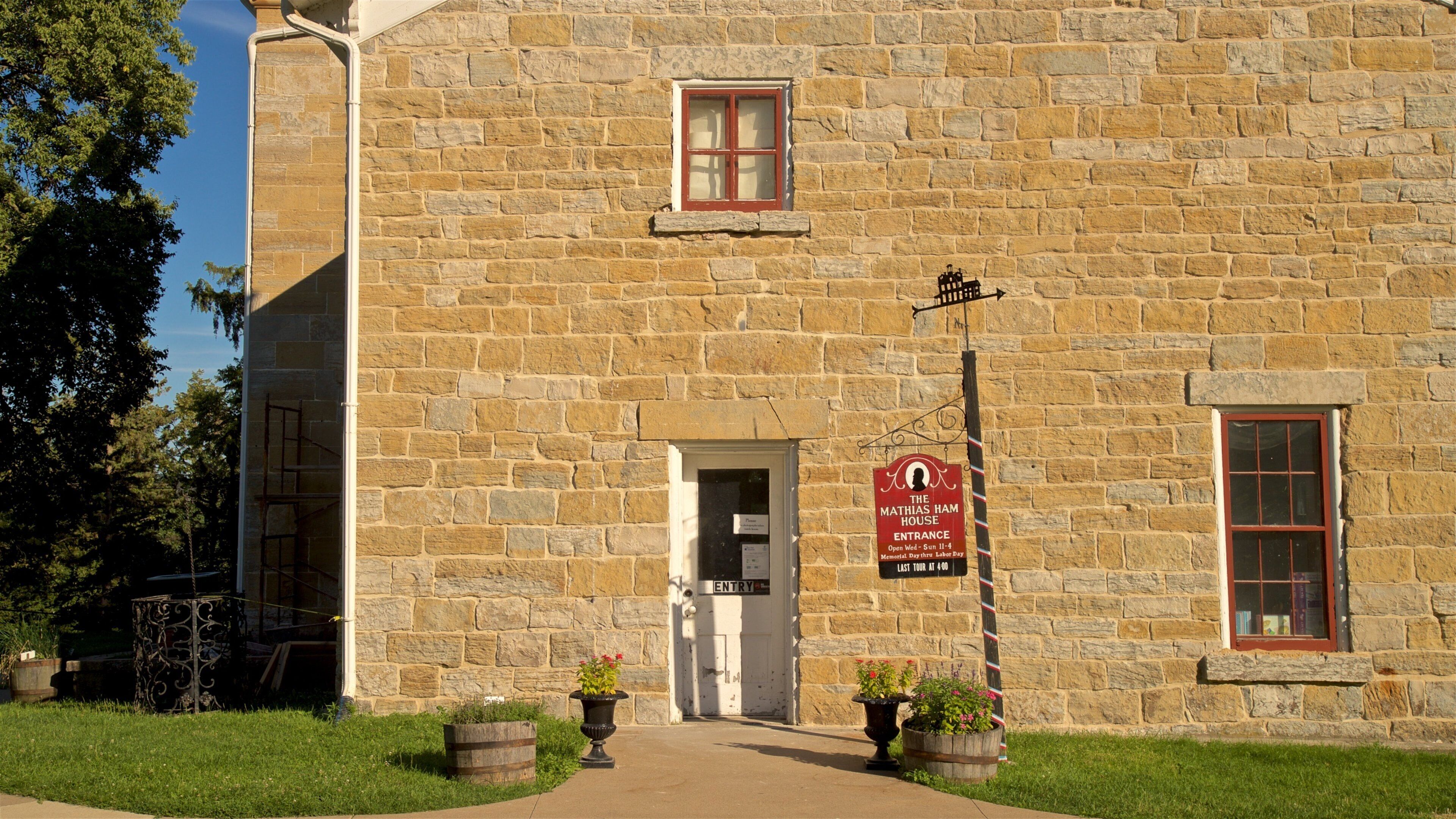 Mathias Ham House showing flowers and signage
