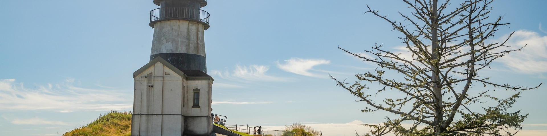 Cape Disappointment Lighthouse featuring a lighthouse as well as a couple