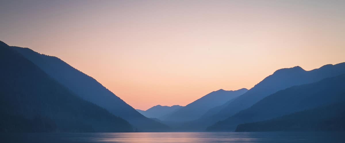 #LifeAtExpediaGroup
Stunning sunsets are the hallmark of Lake Crescent in Washington. The shores of this lake stretch for miles so there are umpteen unique opportunities to enjoy a quiet evening in this beautiful area. Plus, no hikes required, just a few steps down the road and you can have the breadth of peacefulness to yourself.
Photo tip: Make sure to put on your waterproof boots to go a little bit into the water to capture a photo like this.
