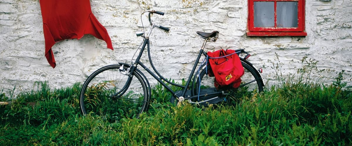 Bicycle outside a cottage, Cregnesh, Isle of Man, British Isles