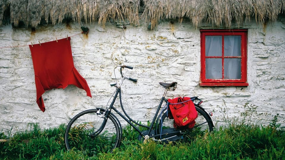 Bicycle outside a cottage, Cregnesh, Isle of Man, British Isles