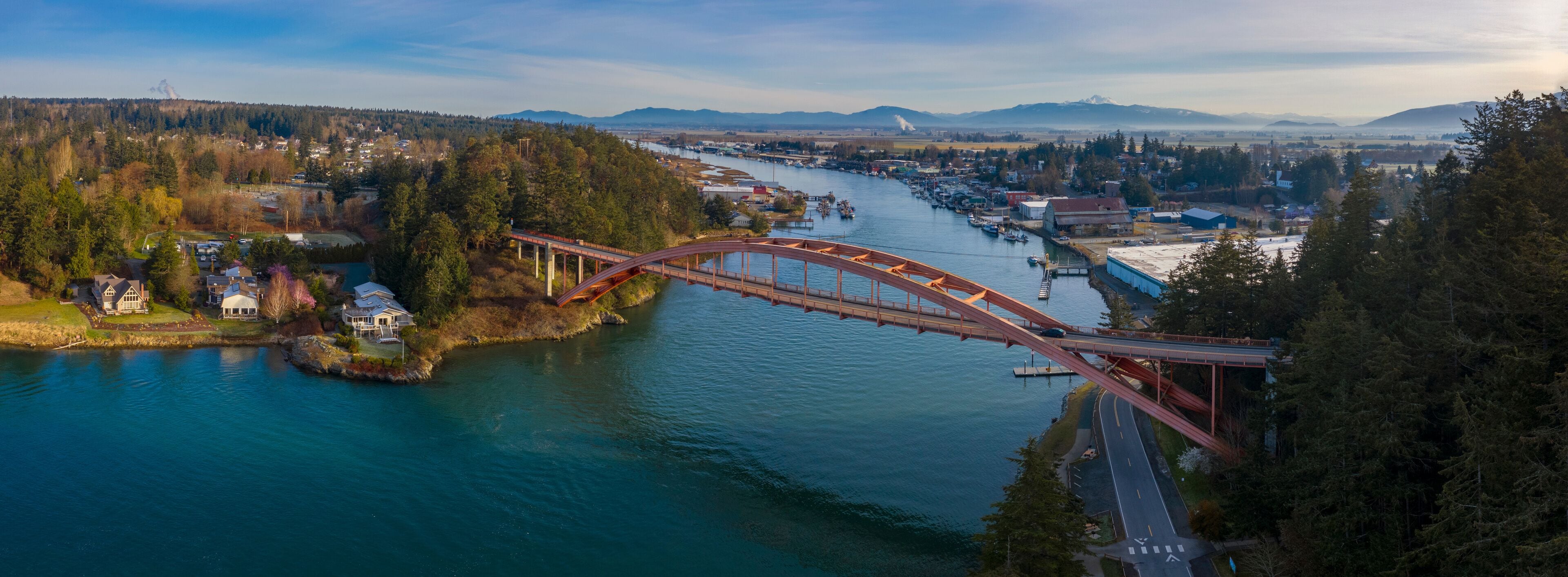 Rainbow Bridge and the City of La Conner, Washington. La Conner is a popular tourist town known for its arts and craft shops located in the beautiful Skagit Valley. Rainbow Bridge is an icon landmark.