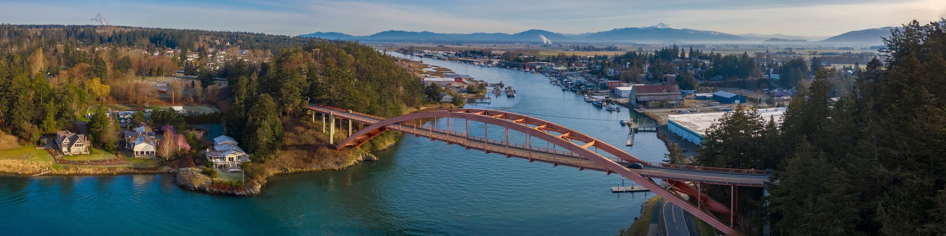 Rainbow Bridge and the City of La Conner, Washington. La Conner is a popular tourist town known for its arts and craft shops located in the beautiful Skagit Valley. Rainbow Bridge is an icon landmark.