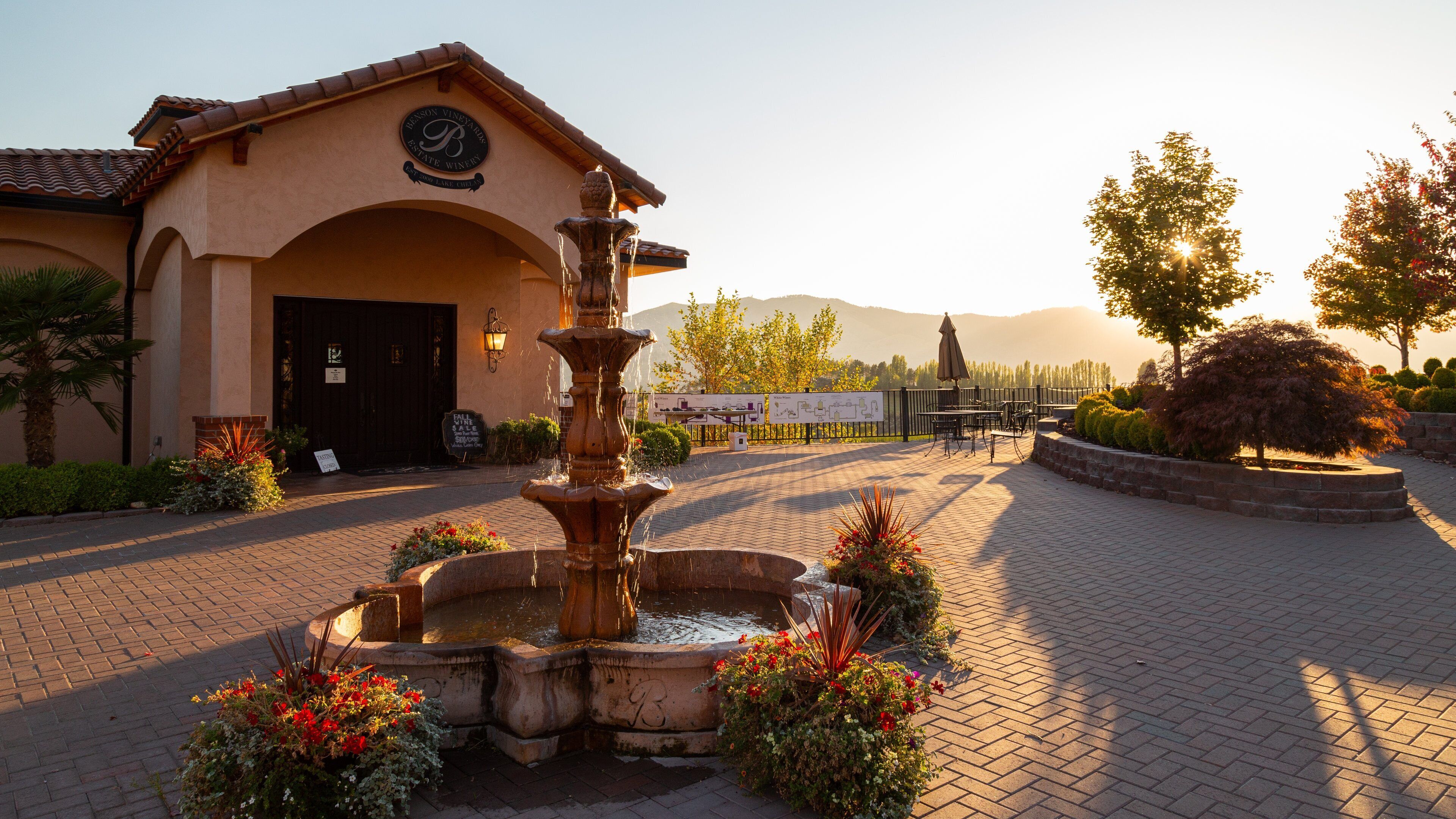Benson Vineyards Estate Winery featuring a sunset and a fountain