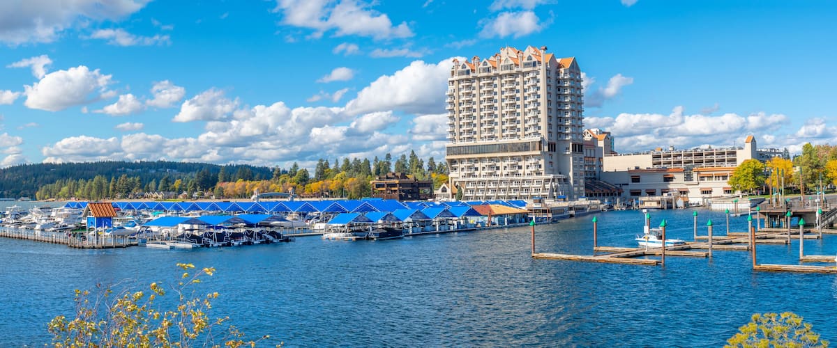Panoramic view from Tubbs Hill park of the resort, marina and boardwalk alongside the city beach and park at autumn in Coeur d'Alene, Idaho, USA.