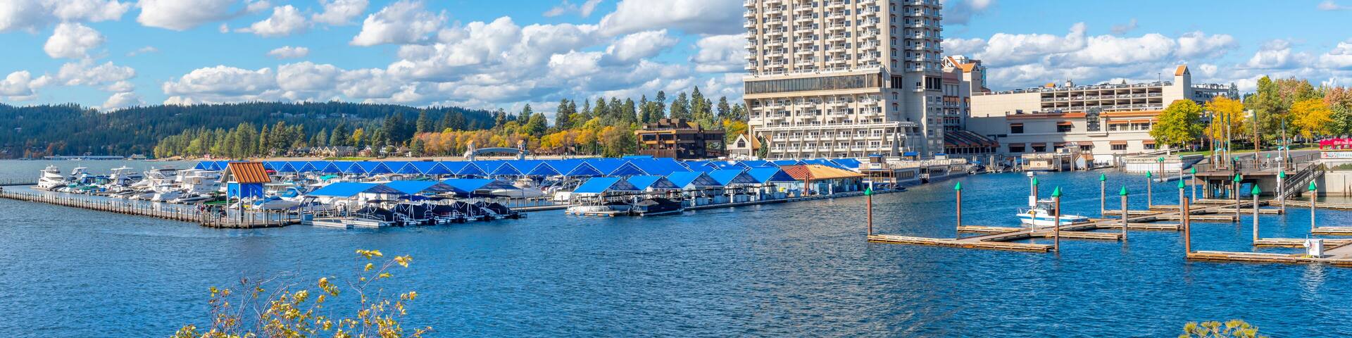 Panoramic view from Tubbs Hill park of the resort, marina and boardwalk alongside the city beach and park at autumn in Coeur d'Alene, Idaho, USA.