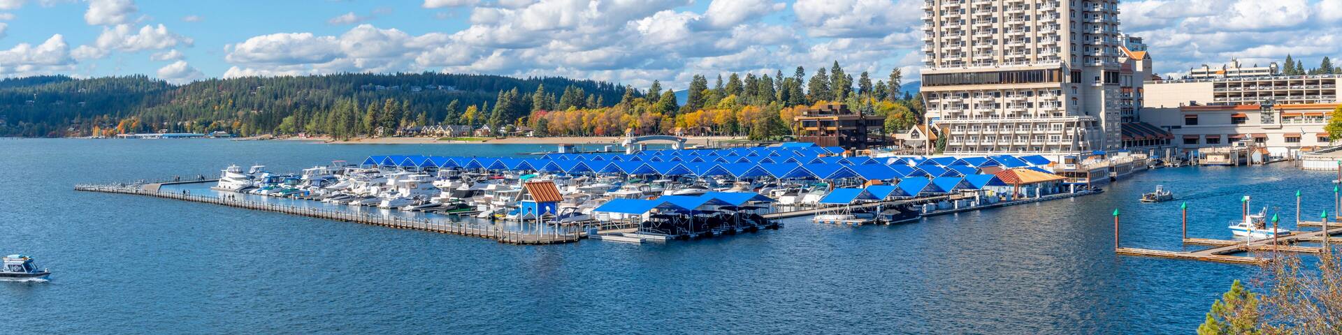 Panoramic view from Tubbs Hill park of the resort, marina and boardwalk alongside the city beach and park at autumn in Coeur d'Alene, Idaho, USA.