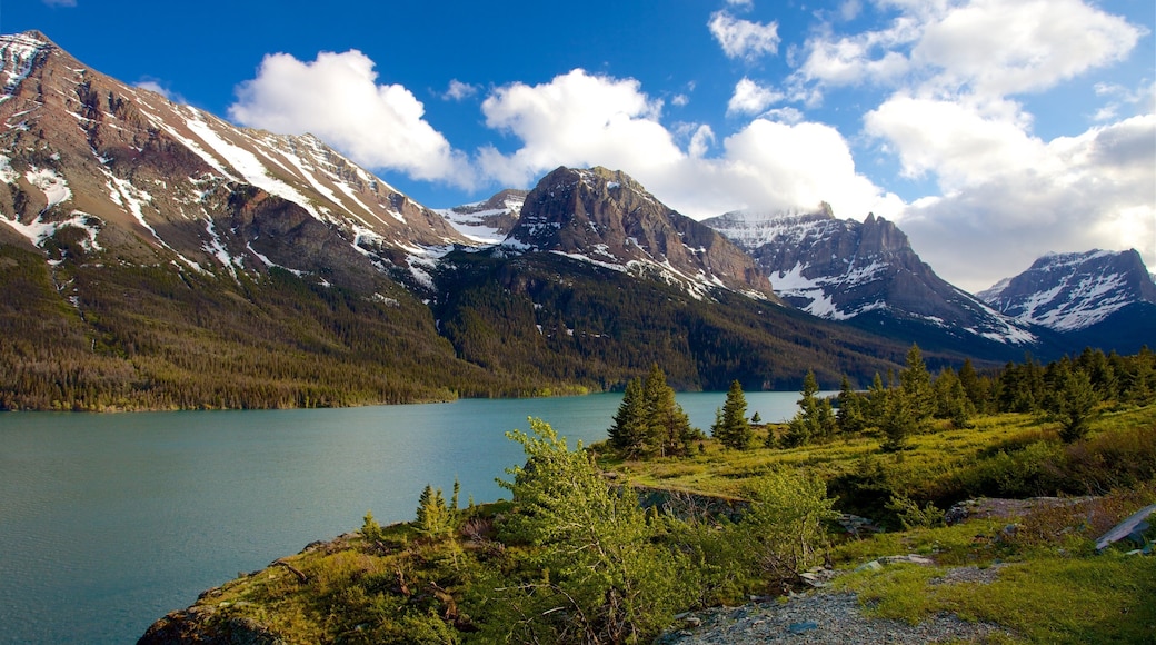 St. Mary Lake which includes landscape views, a river or creek and mountains