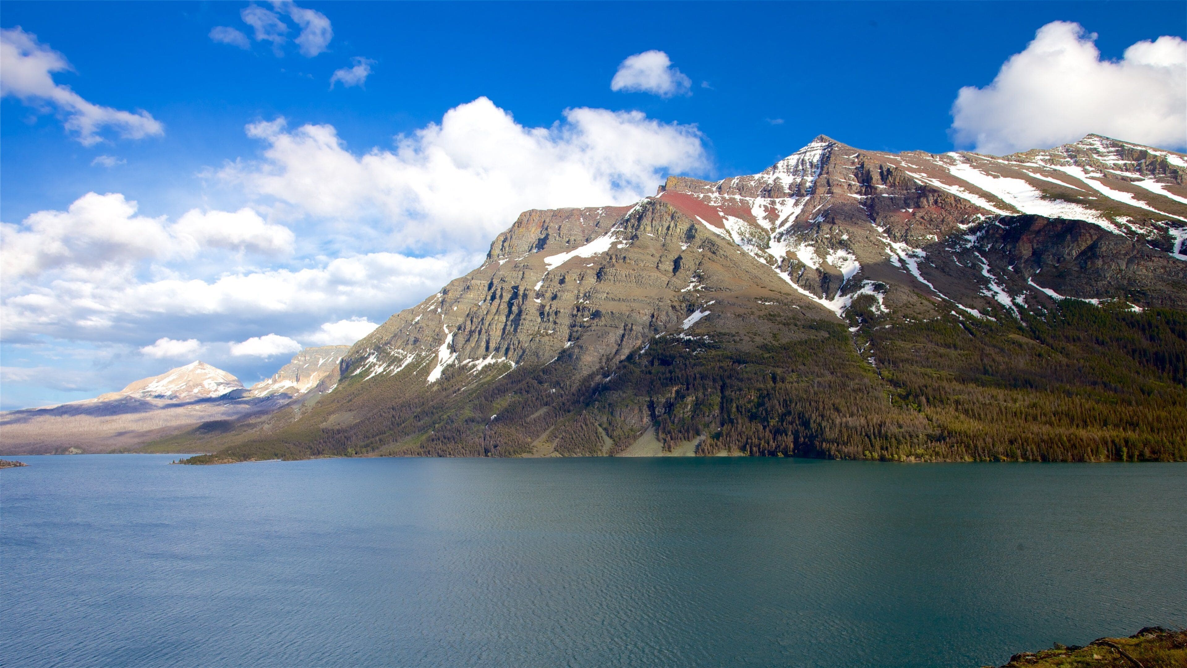 St. Mary Lake featuring mountains, a river or creek and tranquil scenes