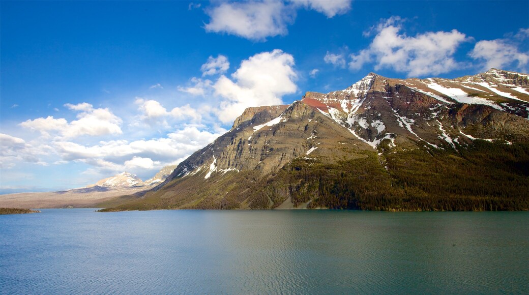 St. Mary Lake which includes mountains, a river or creek and landscape views