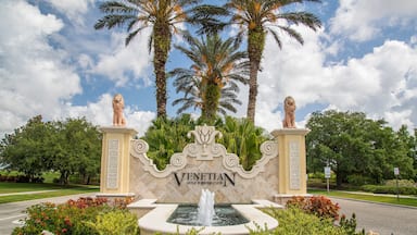 Venetian Golf and River Club which includes signage and a fountain