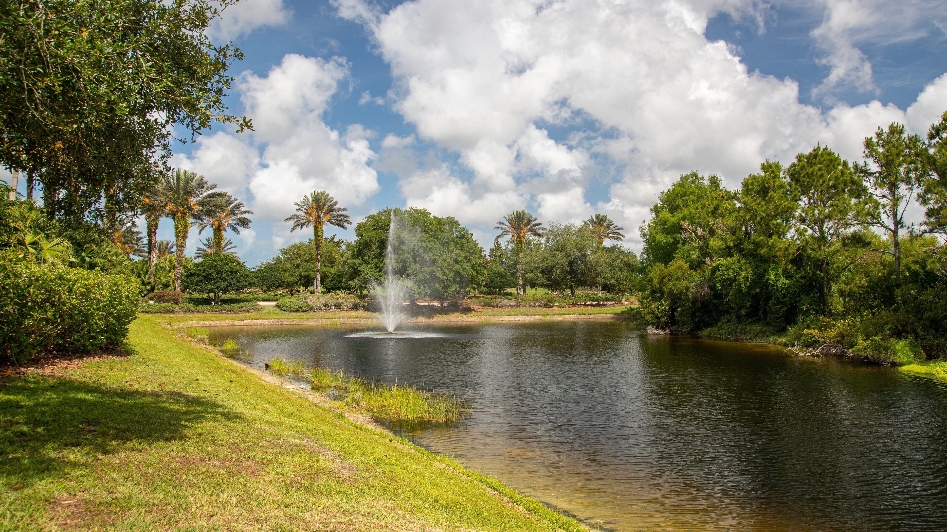 Venetian Golf and River Club featuring a fountain and a river or creek