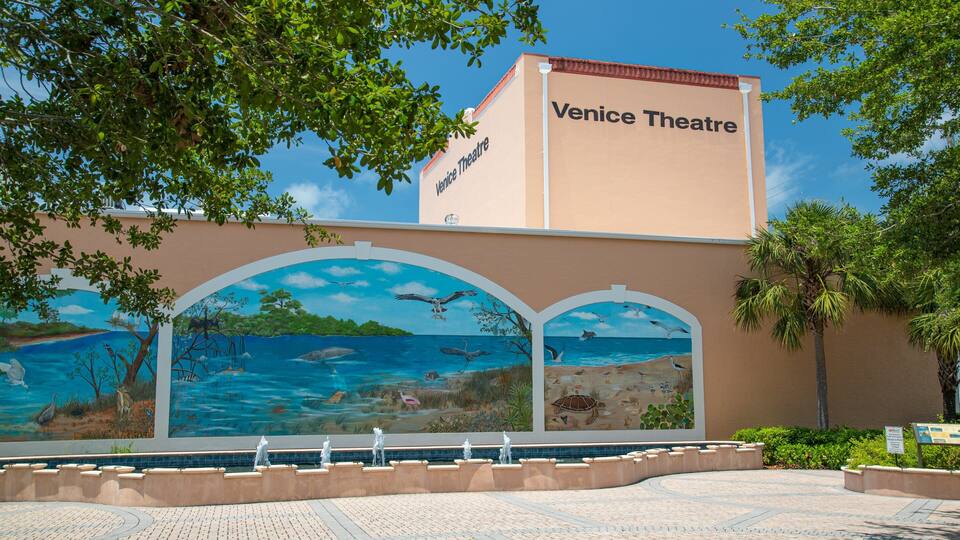Venice Theater featuring signage and outdoor art