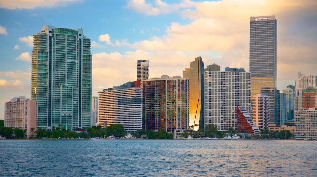 Rickenbacker Causeway Beach featuring a sunset, a river or creek and a skyscraper