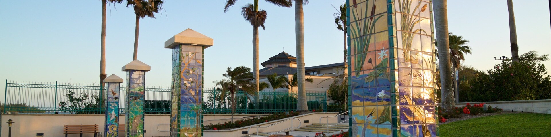 Royal Palm Pointe Park which includes outdoor art, a sunset and a garden