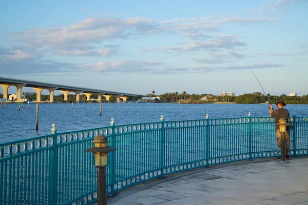 Royal Palm Pointe Park featuring fishing and a river or creek as well as an individual male
