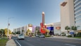 A street with a large guitar-shaped sign and the Hard Rock Hotel and Casino.