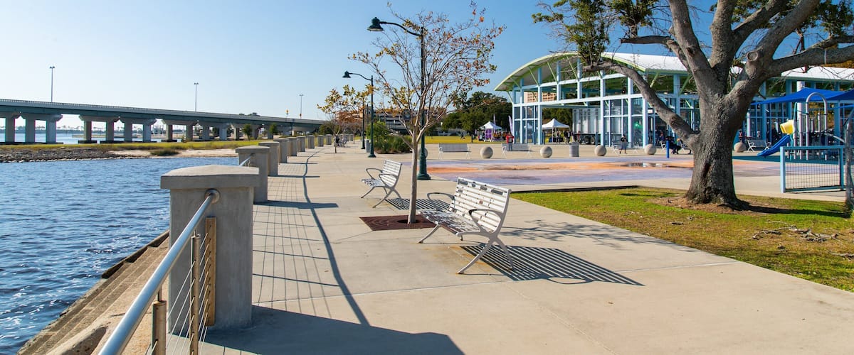 Point Cadet Plaza which includes a park and a river or creek