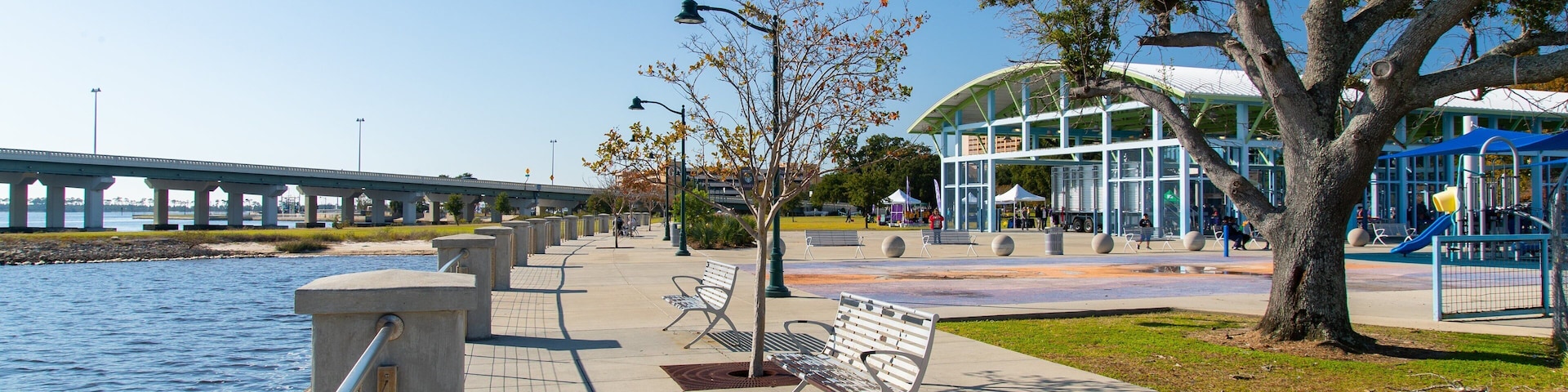 Point Cadet Plaza which includes a park and a river or creek