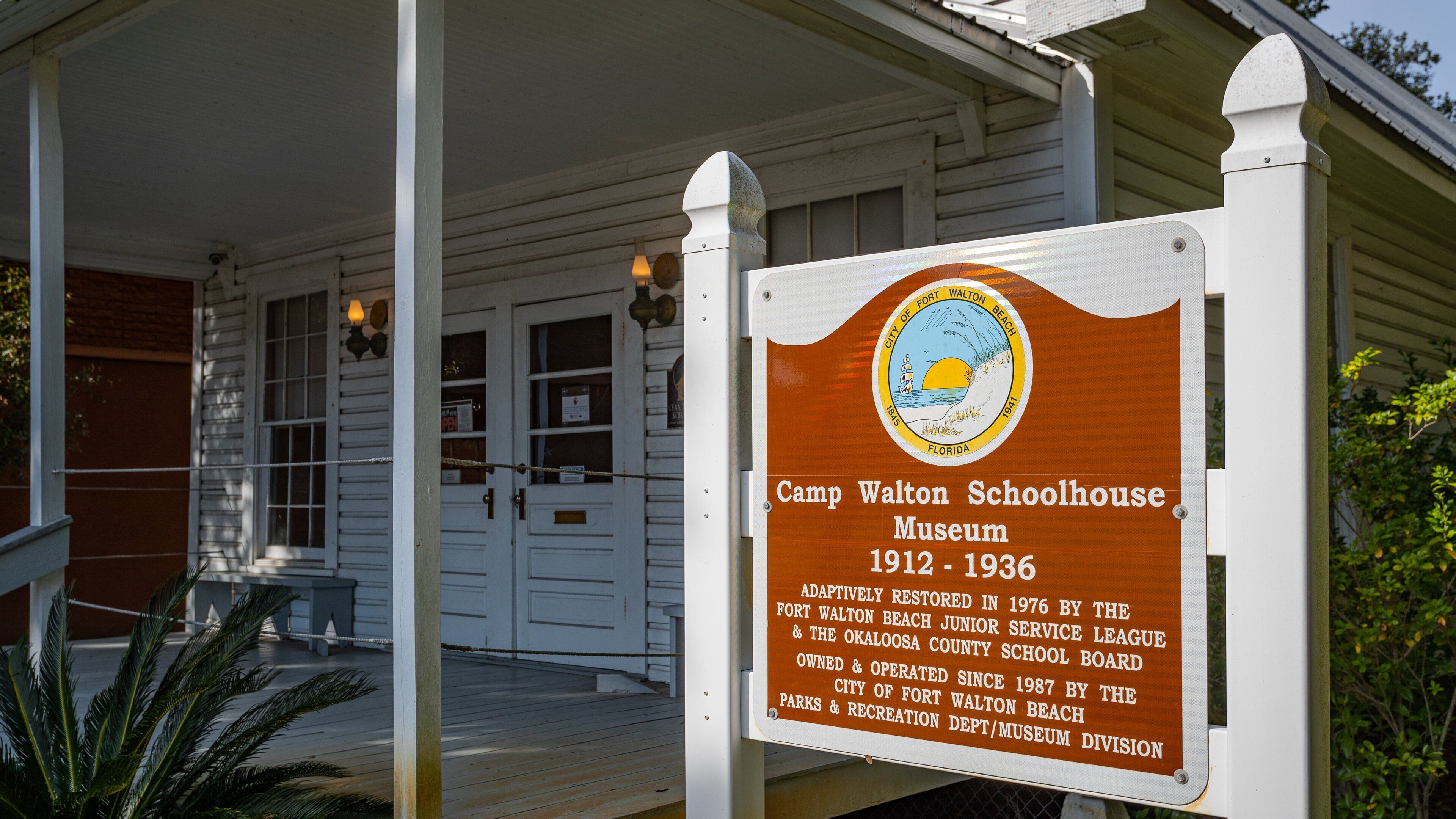 Camp Walton Schoolhouse Museum featuring signage
