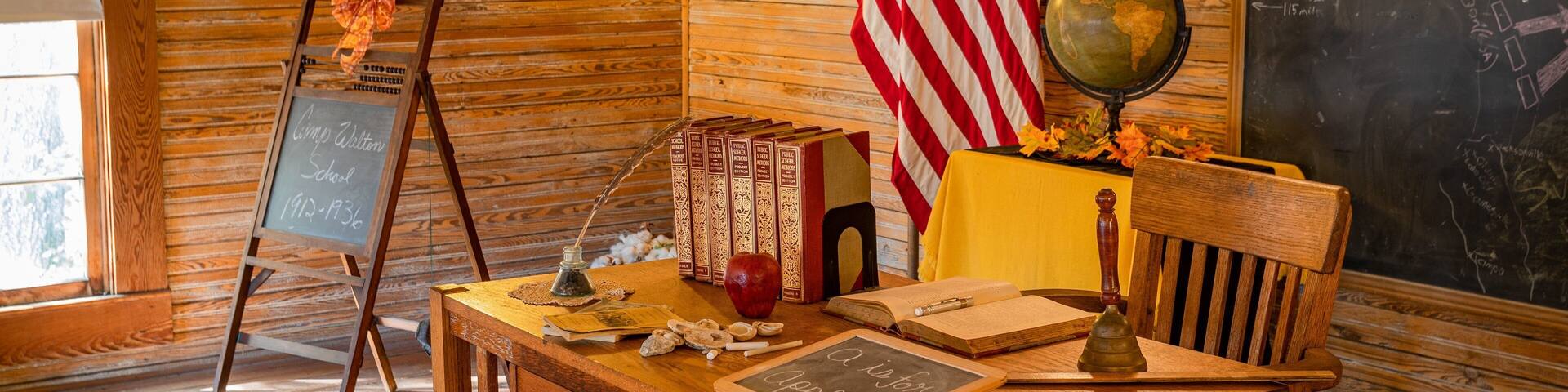 Camp Walton Schoolhouse Museum showing interior views