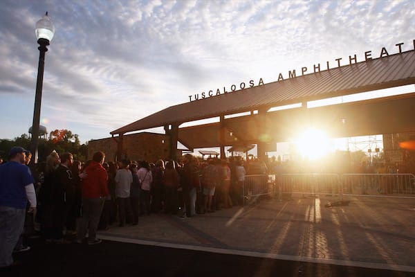 A crowd at Tuscaloosa Amphitheater during sunset.
