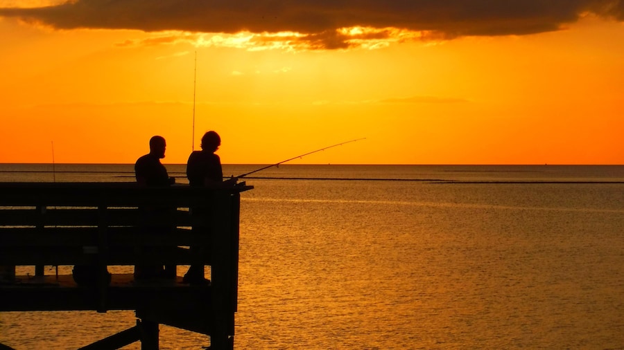 United States, Florida, Citrus County, Crystal River, Fisherman at sunset at Fort Island Beach