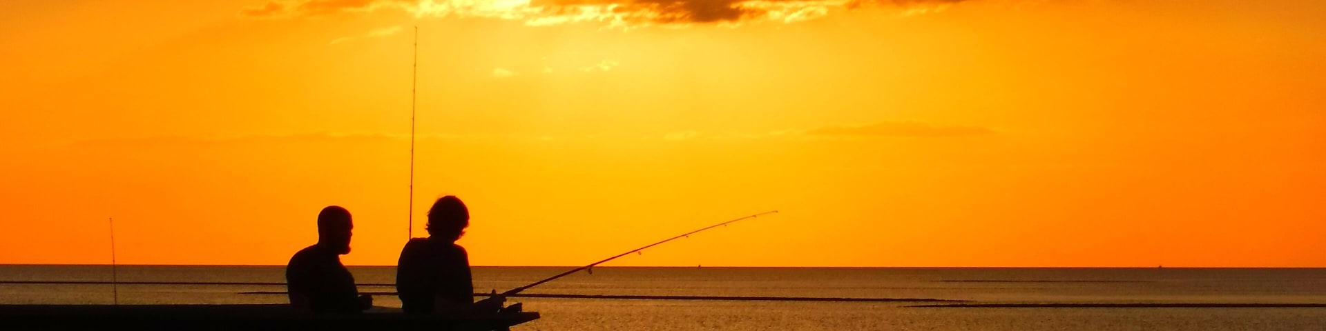 United States, Florida, Citrus County, Crystal River, Fisherman at sunset at Fort Island Beach
