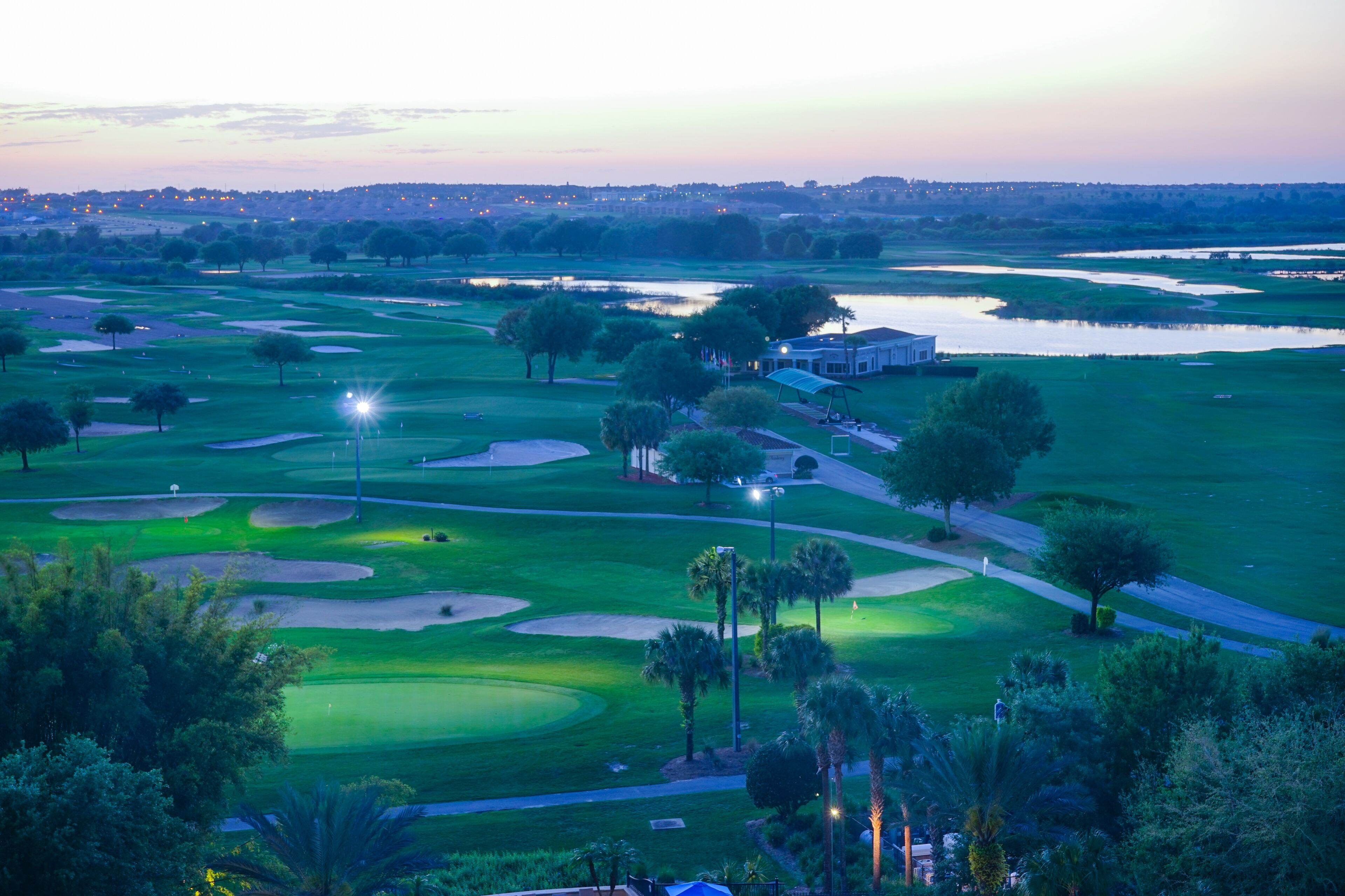 Aerial view of a golf course at sun set