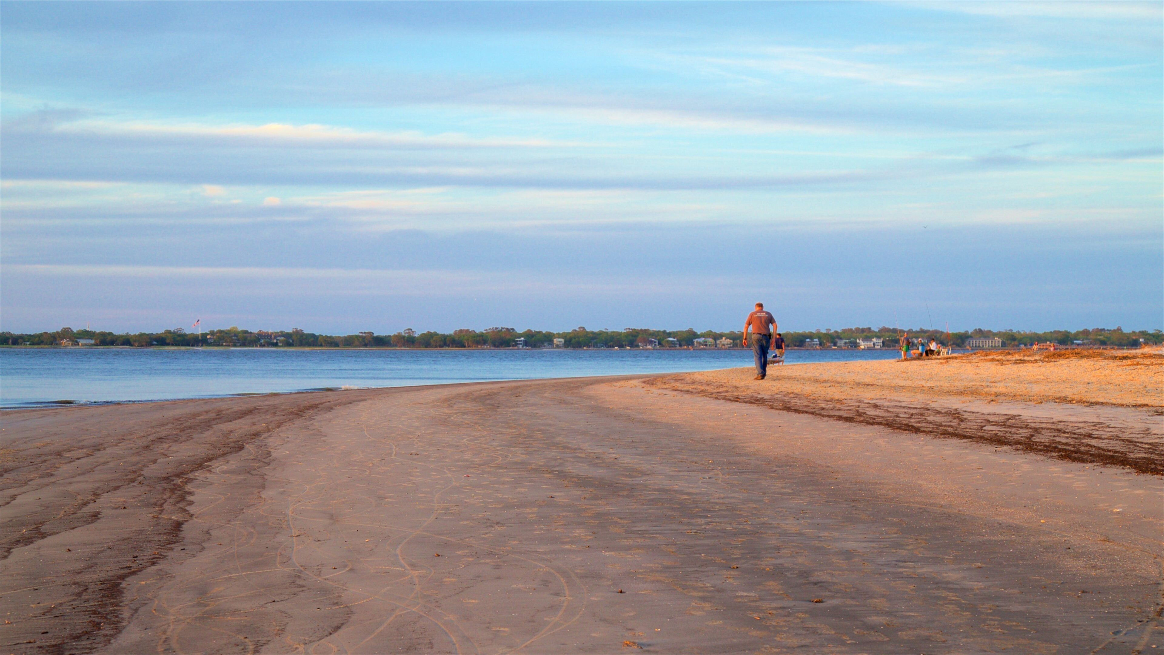 Driftwood Beach showing general coastal views, a sunset and a sandy beach
