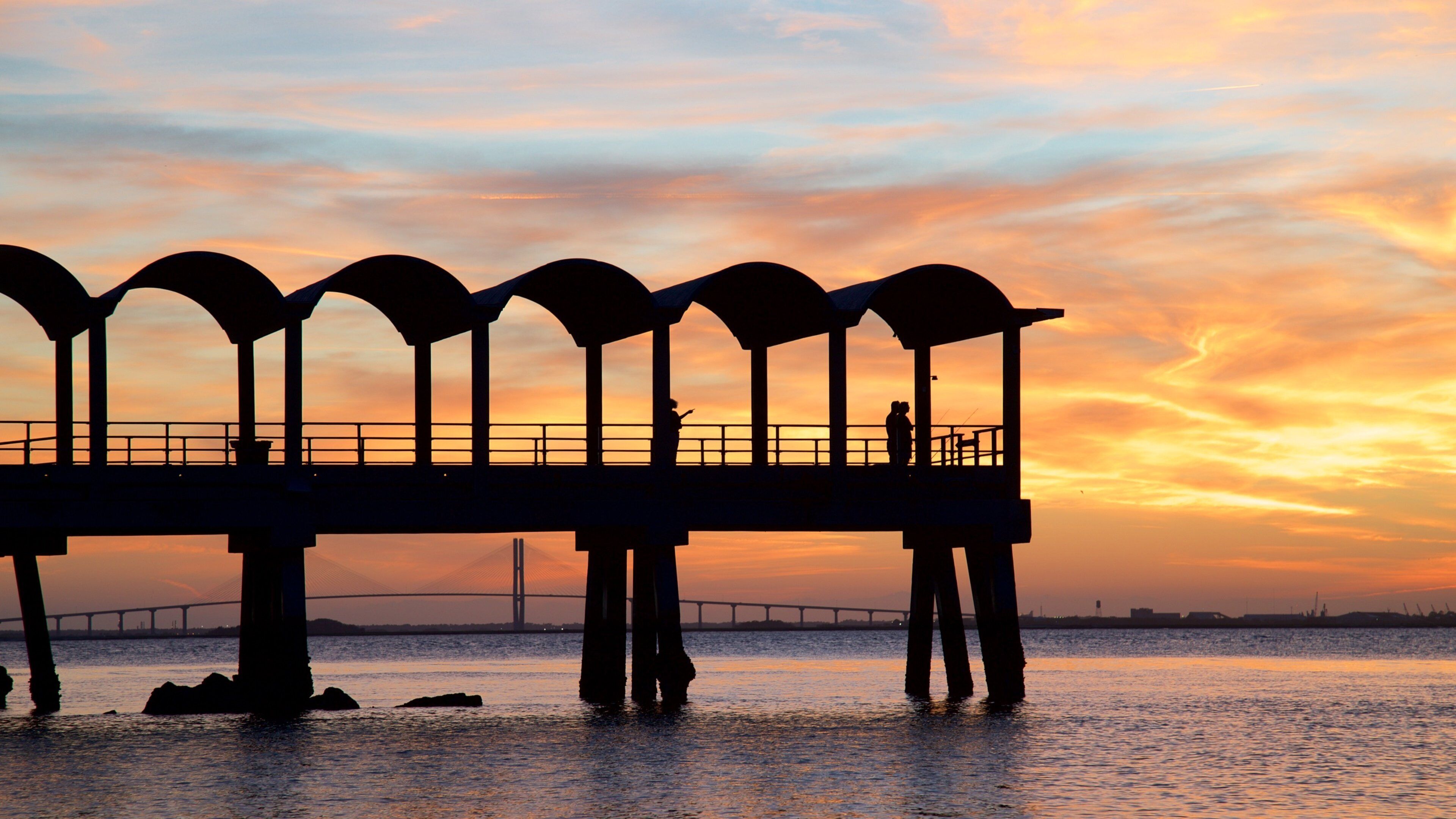 Driftwood Beach featuring general coastal views and a sunset