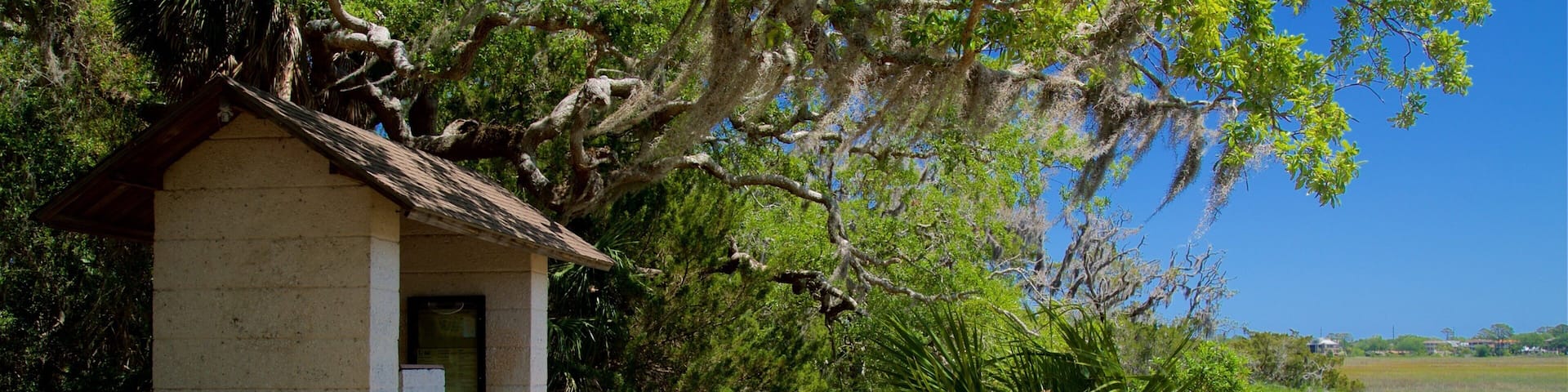 Bloody Marsh Battle Site featuring tranquil scenes, signage and a garden