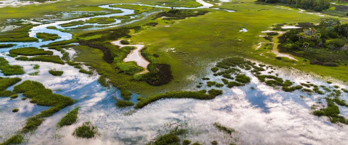 Southern aerial marsh views with reflection of sky