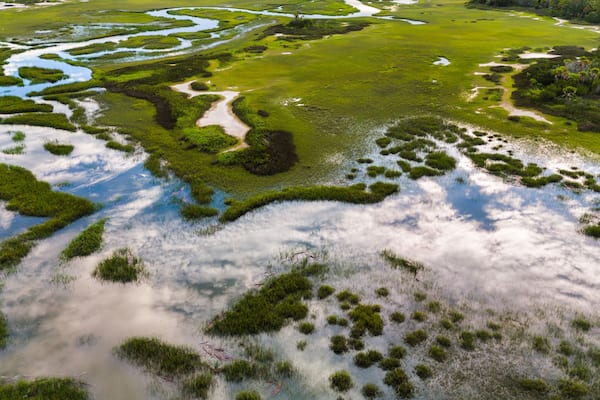 Southern aerial marsh views with reflection of sky