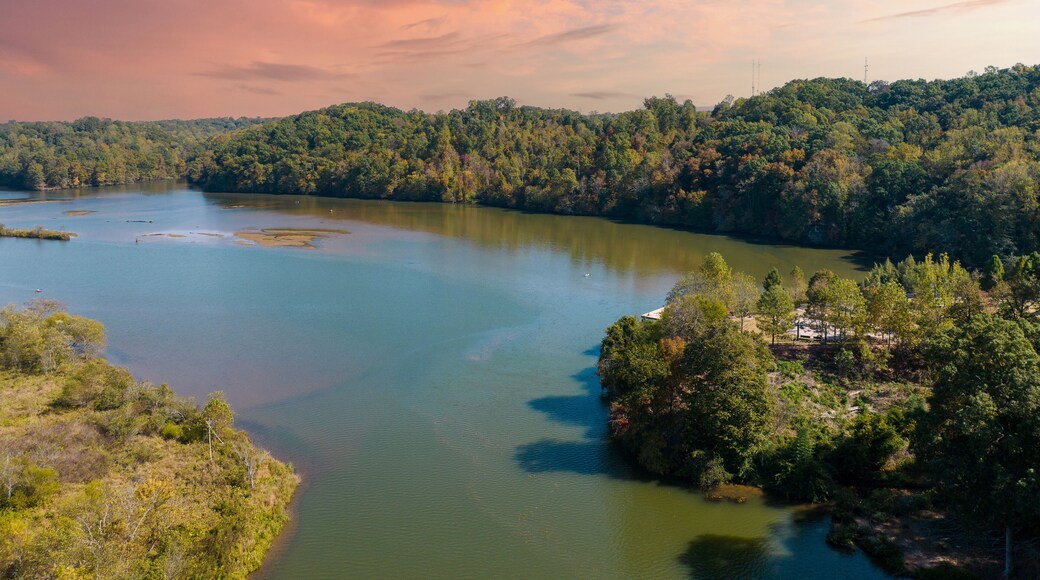 Aerial view of water at Morgan Falls Overlook Park with pink and blue skies